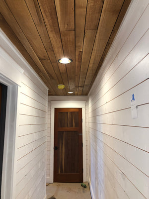 hallway with barn wood ceiling planks