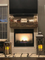 Reclaimed wood beam mantle over fireplace 
